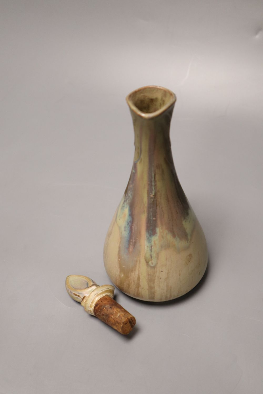 Three items of Art Pottery, including a stoneware ewer and stopper,